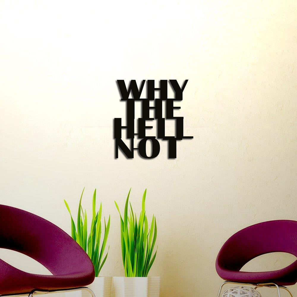 Black MDF wall art displaying the motivational quote "WHY THE HELL NOT" in bold typography, mounted on a beige wall above potted plants and modern purple chairs.