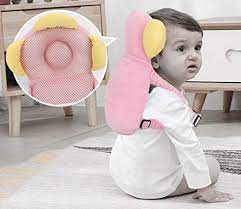 Pink and yellow baby head protector with adjustable straps for toddler safety. The image shows hoe is it to be worn by the kids